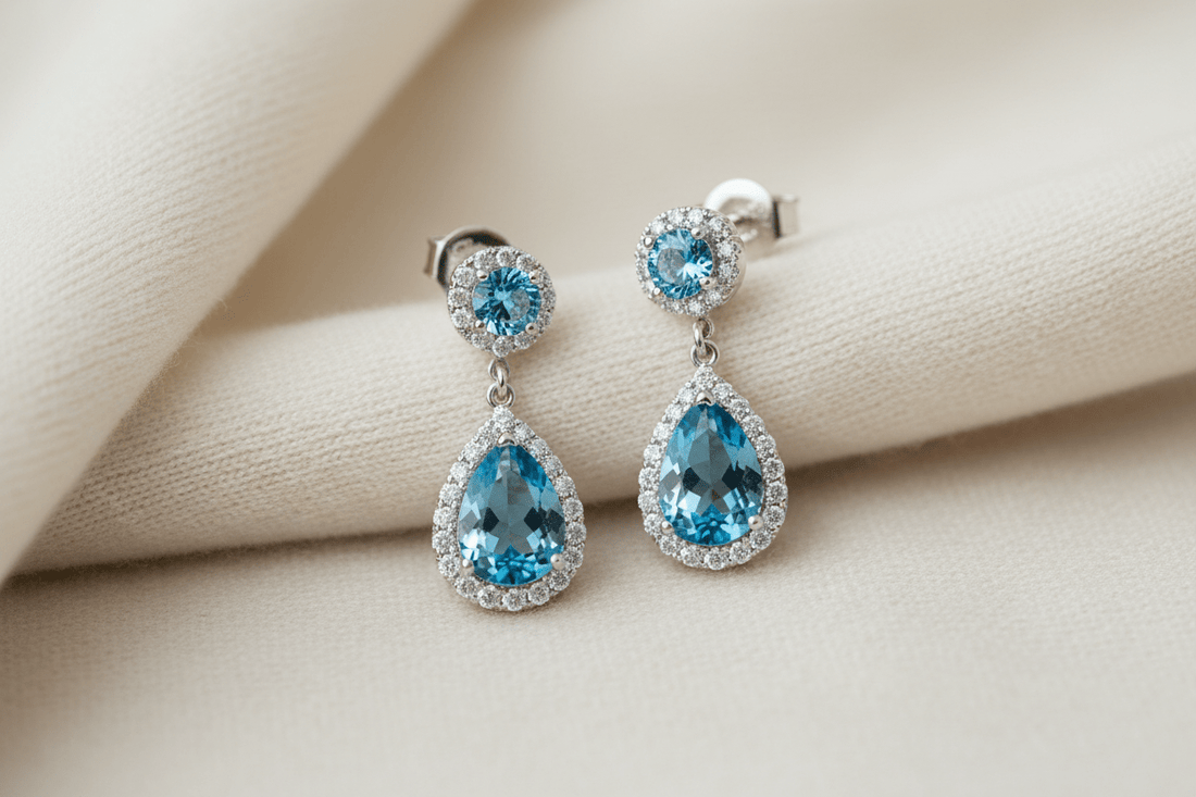 Sterling silver drop and dangle earrings with blue topaz and diamond accents — a guide to choosing the perfect pair from BijouxNYC Direct.