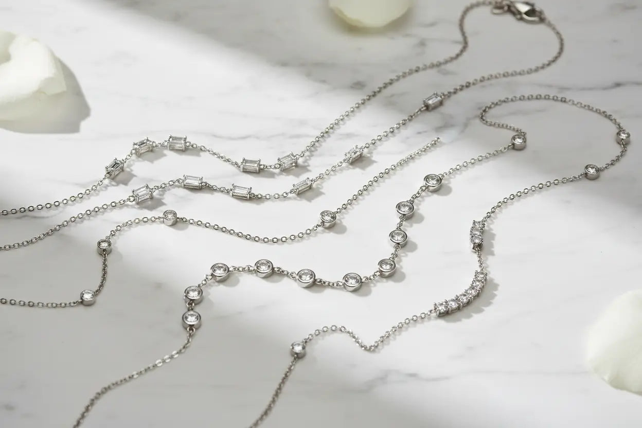Diamond station necklaces in emerald cut, marquise, bezel set, and three-stone bar styles in 14K white gold and sterling silver – Bijoux NYC Direct
