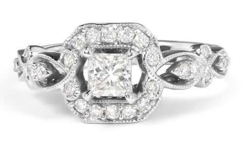 Diamond ring with floral design on a white background