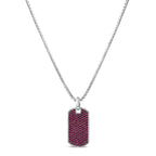 Dog tag pendant with red stones on a silver chain against a white background