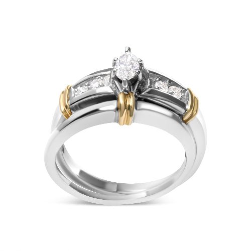 Two-tone ring with a central diamond and smaller stones on a white background