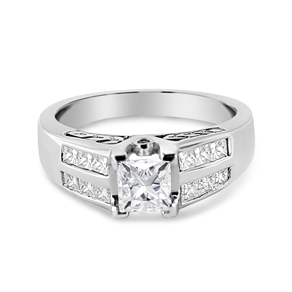 Silver ring with a central diamond and smaller diamonds on a white background