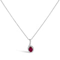 Silver necklace with a red gemstone pendant on a white background
