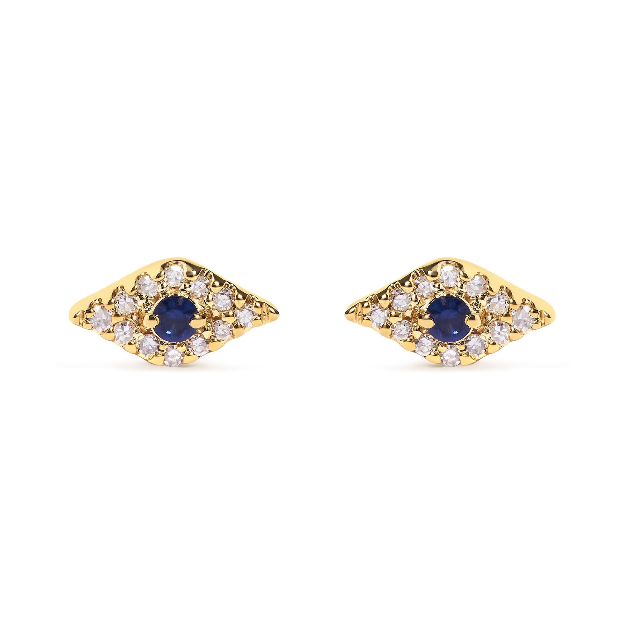 Pair of gold earrings with blue gemstones on a white background