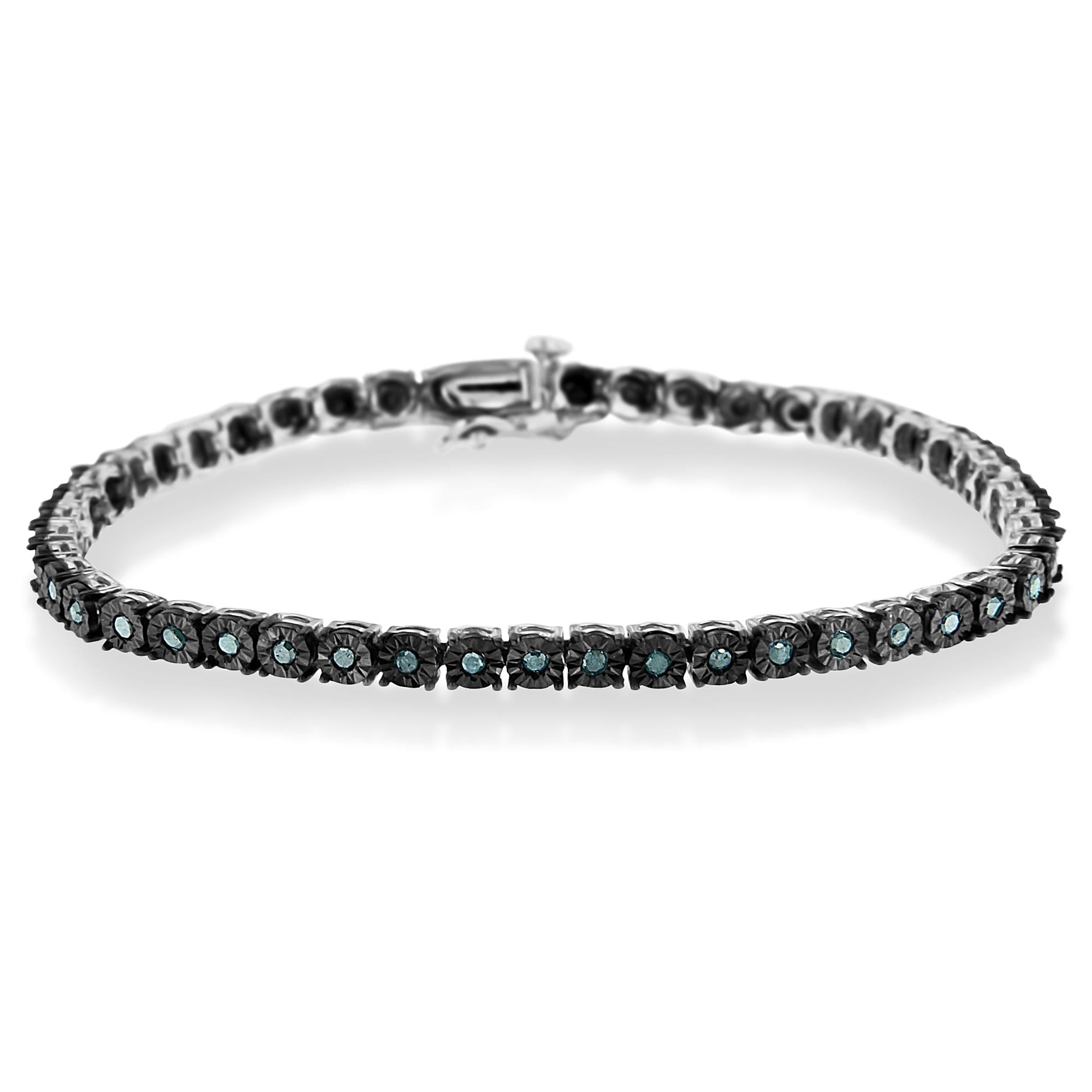 Silver bracelet with black stones on a white background
