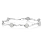 Silver bracelet with floral designs on a white background
