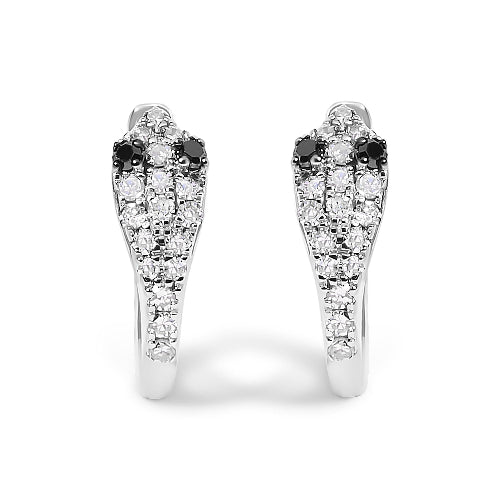 Pair of snake-shaped earrings with black and white gemstones on a white background