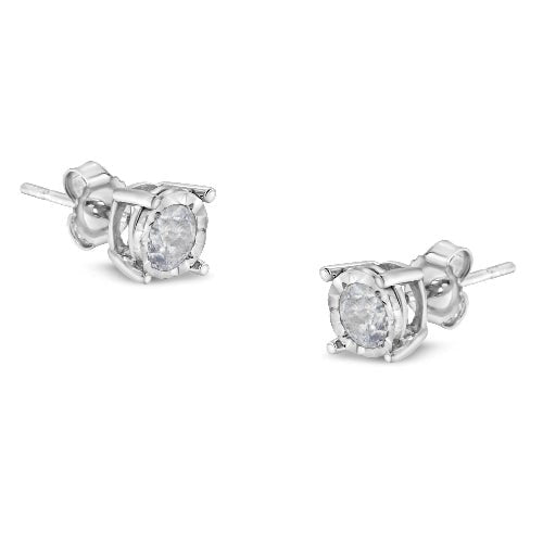 Pair of diamond stud earrings on a white background