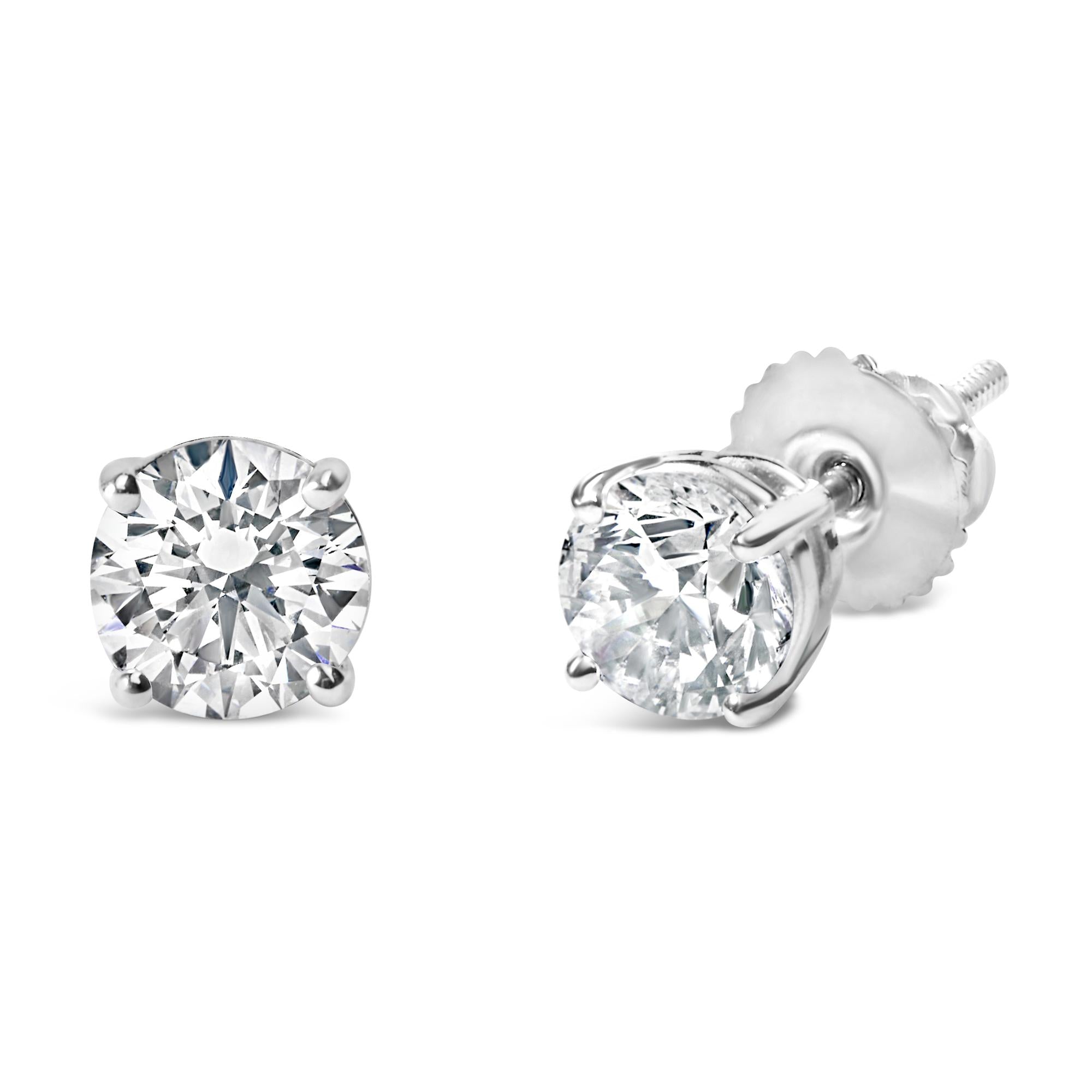 Pair of IGI certified diamond stud earrings on a white background