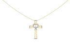 Gold necklace with a cross pendant featuring a heart design on a white background