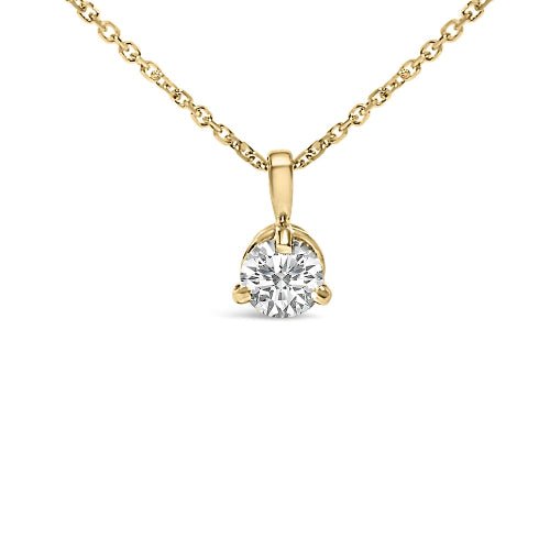 Gold necklace with a diamond pendant on a white background