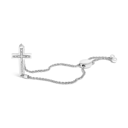 Silver bracelet with a cross charm on a white background