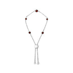 Necklace with red beads and a white clasp on a white background