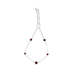 Bracelet with red beads on a white background