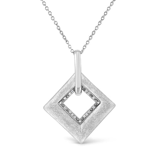Silver pendant necklace with a textured square design on a white background