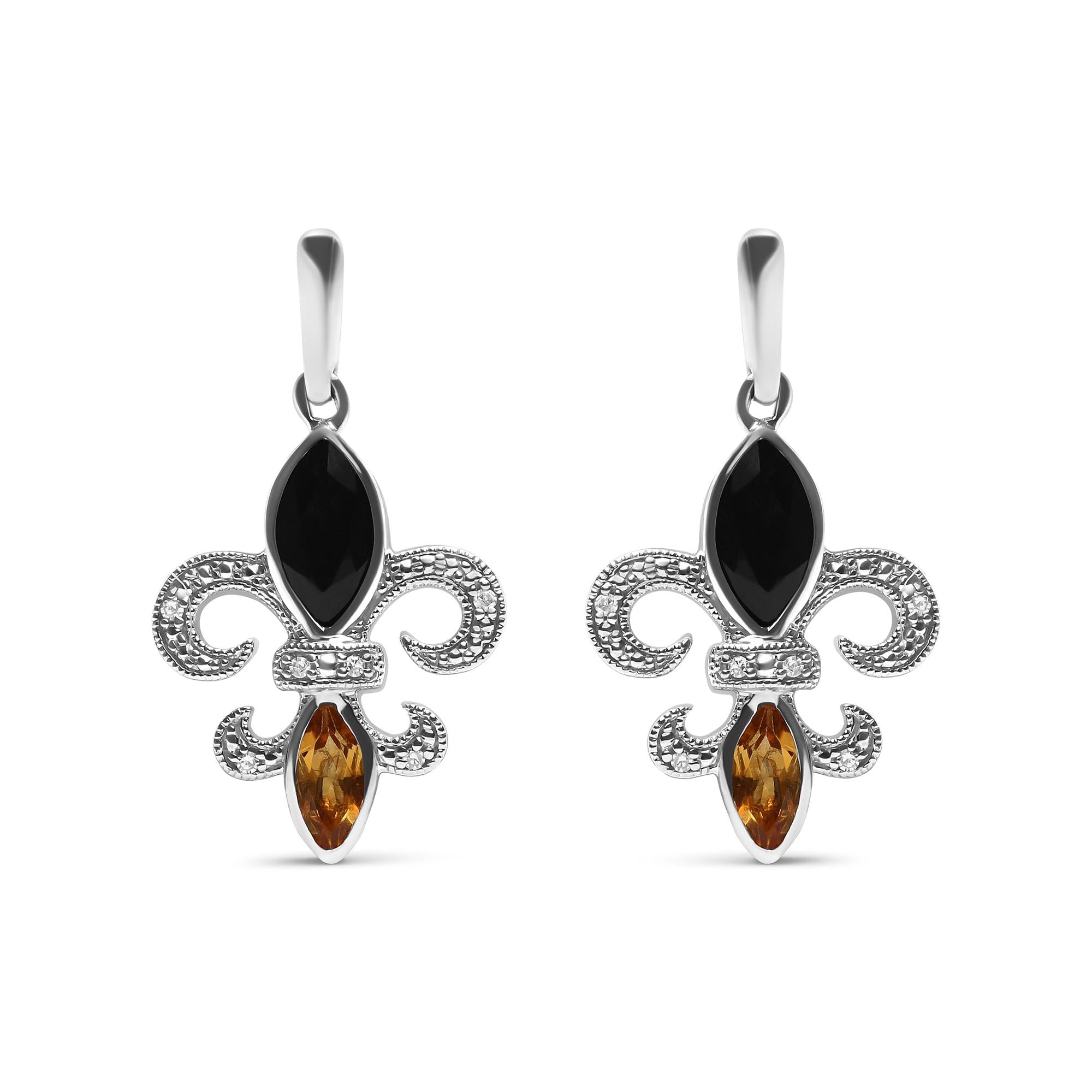 Pair of silver earrings with black and amber stones on a white background
