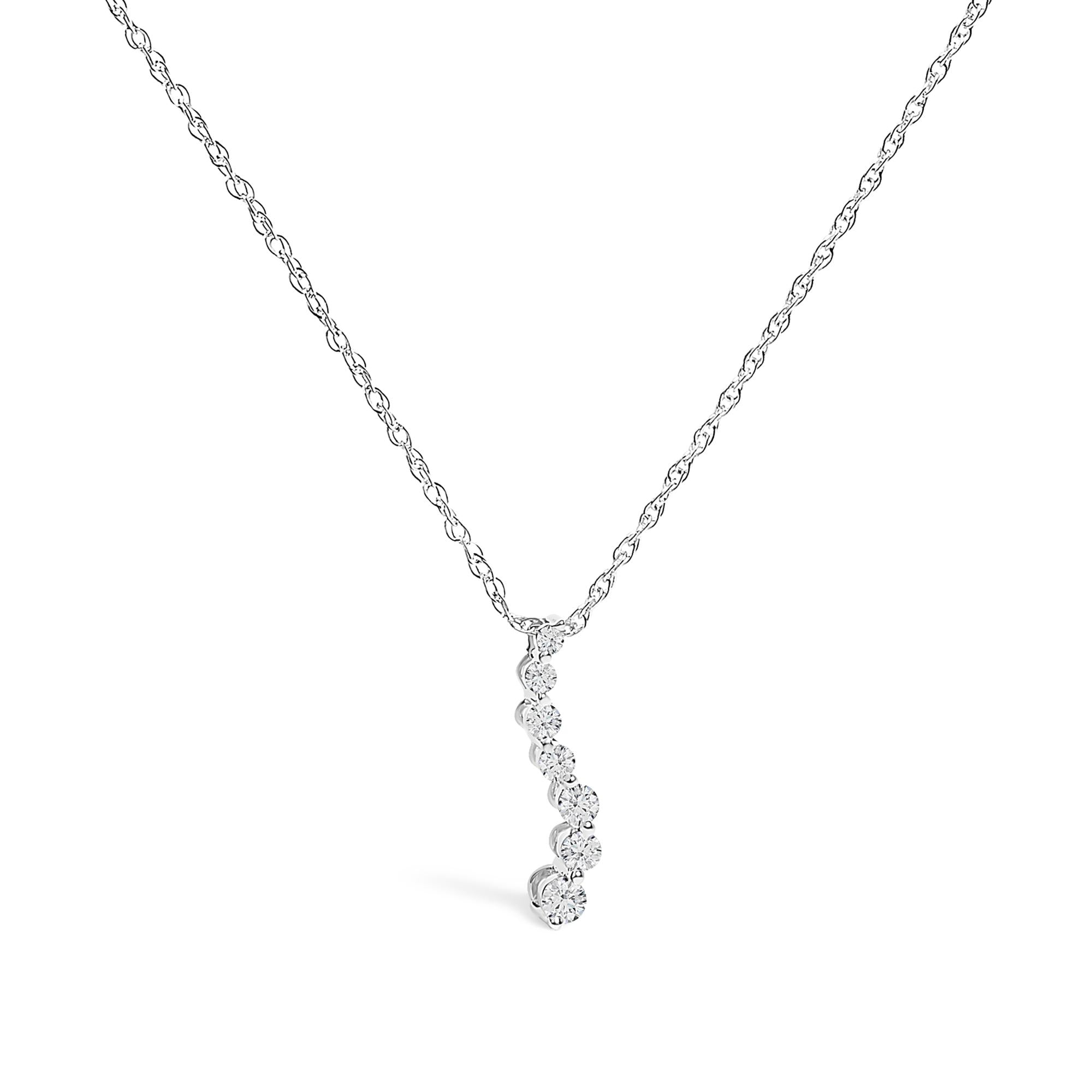 Silver necklace with a small pendant on a white background