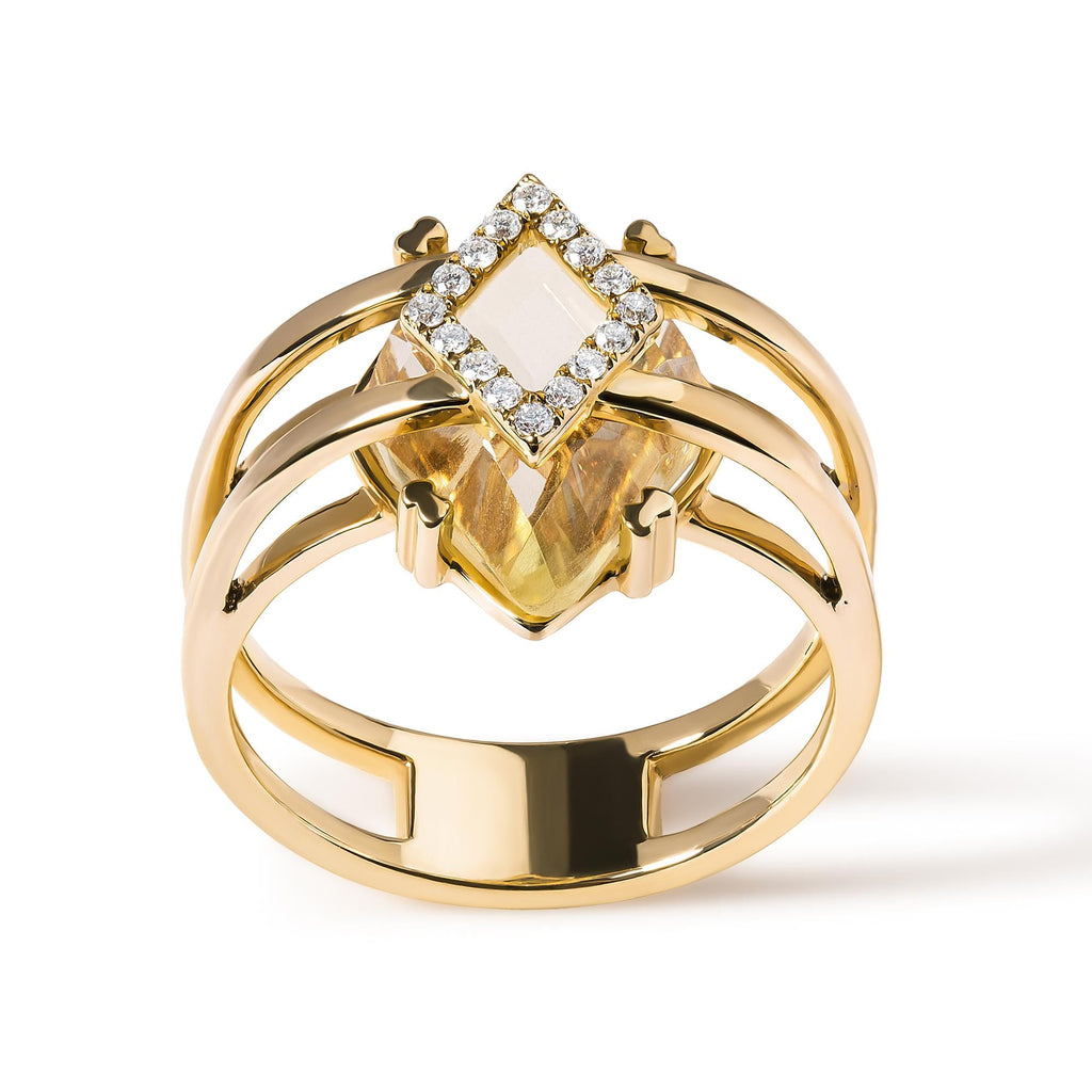 Gold ring with a central gemstone and diamond accents on a white background