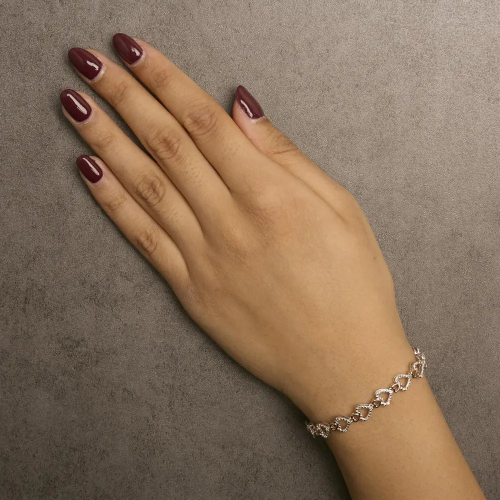 1/4 cttw diamond heart link bracelet in 10k rose gold plated silver 7.25in bijoux-nyc direct