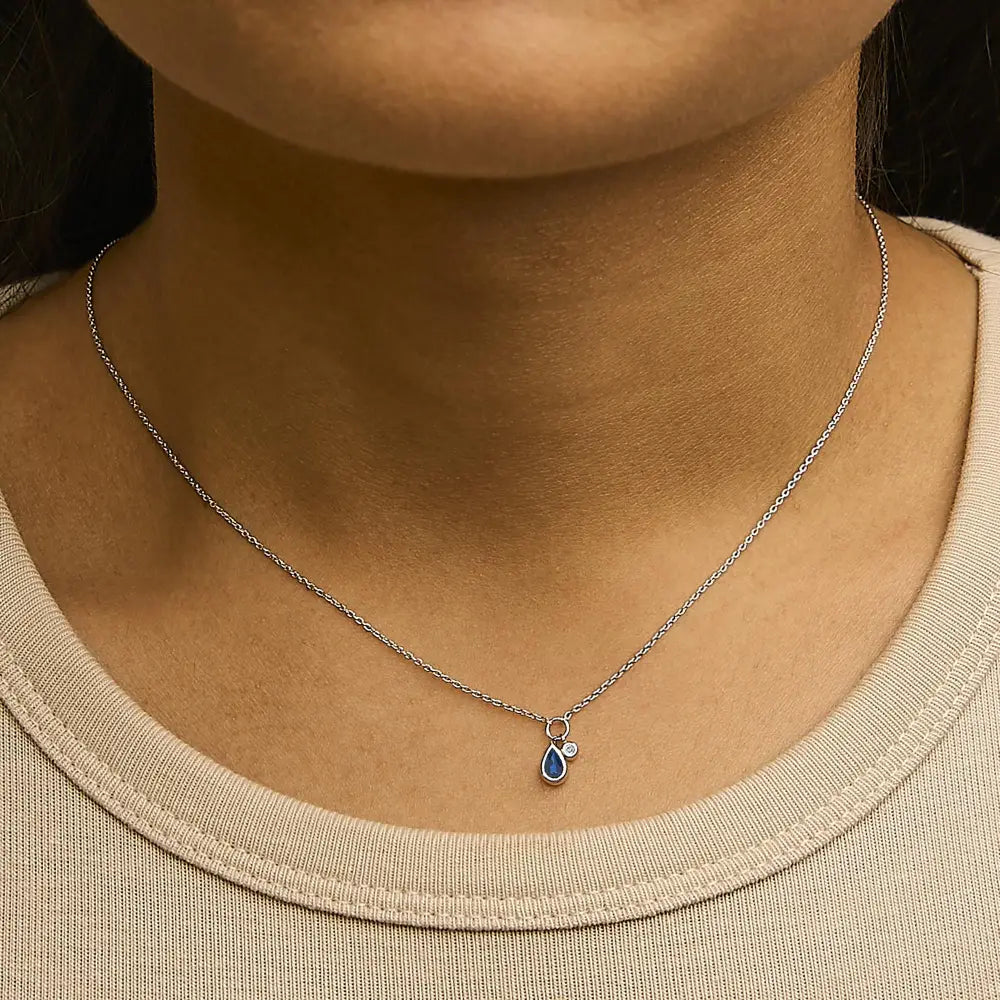 10k white gold pear blue sapphire and diamond pendant necklace 18 inches bijoux-nyc direct