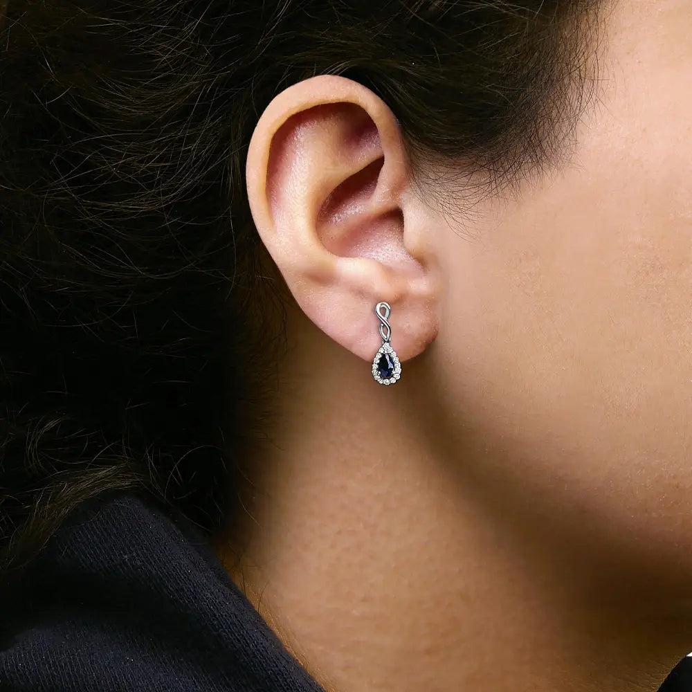 Blue sapphire and 1/7 cttw diamond infinity drop earrings in 10k white gold bijoux-nyc direct