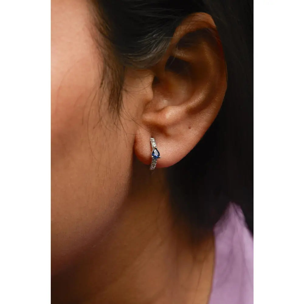 10k white gold pear blue sapphire and 1/10 cttw diamond huggy earrings bijoux-nyc direct