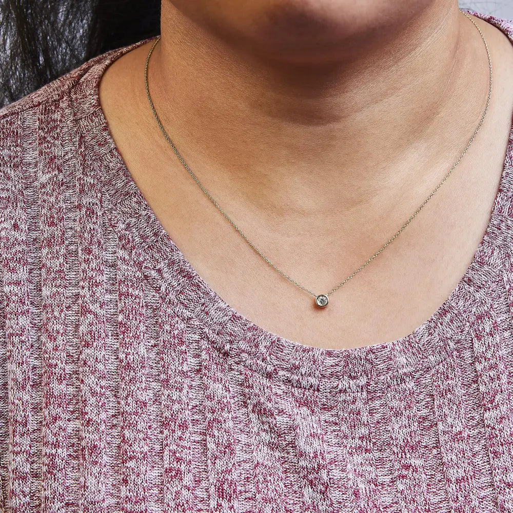 1/2 carat diamond bezel solitaire necklace in 10k yellow gold bijoux-nyc direct