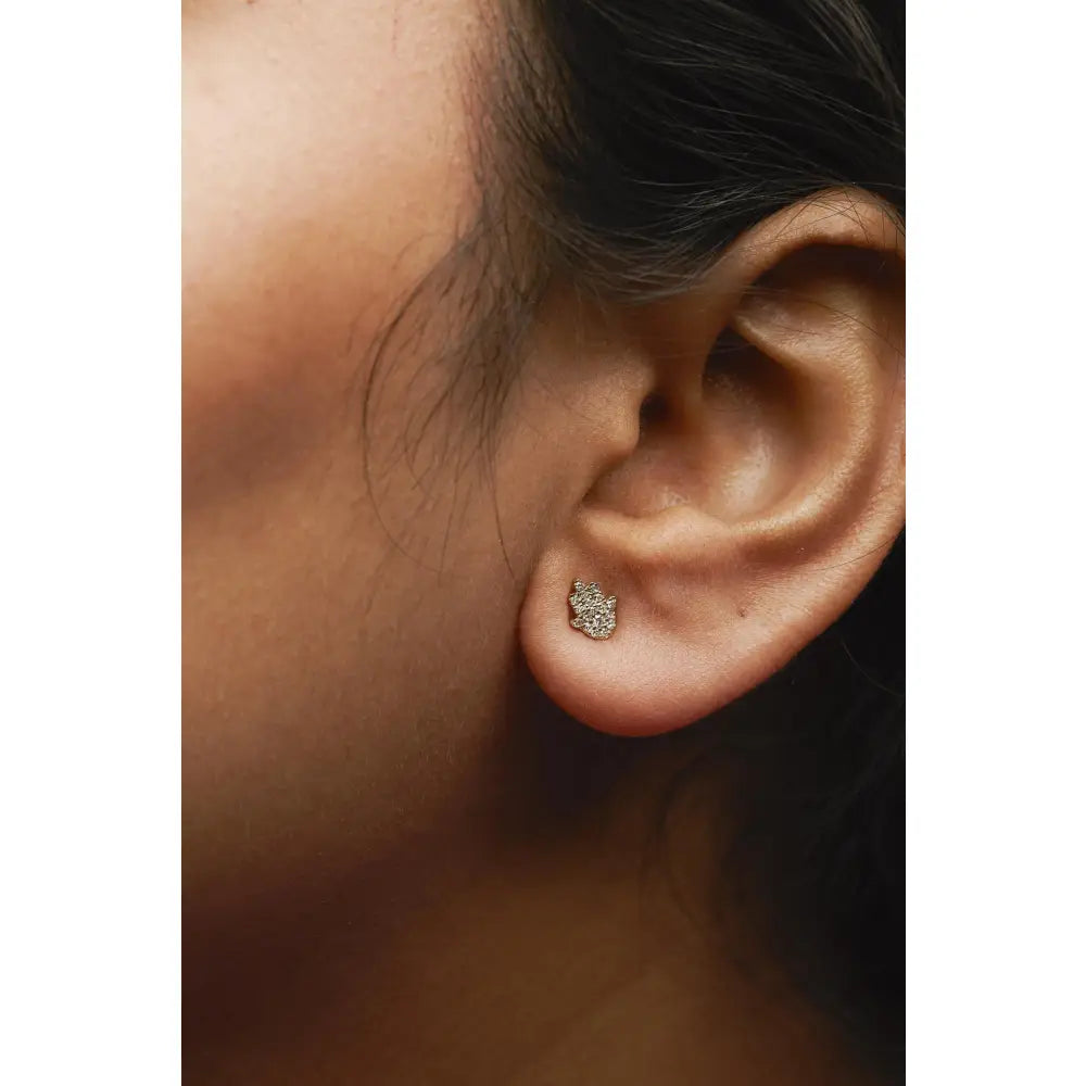 Diamond hamsa stud earrings in 10k yellow gold – 36-stone pavé bijoux-nyc direct