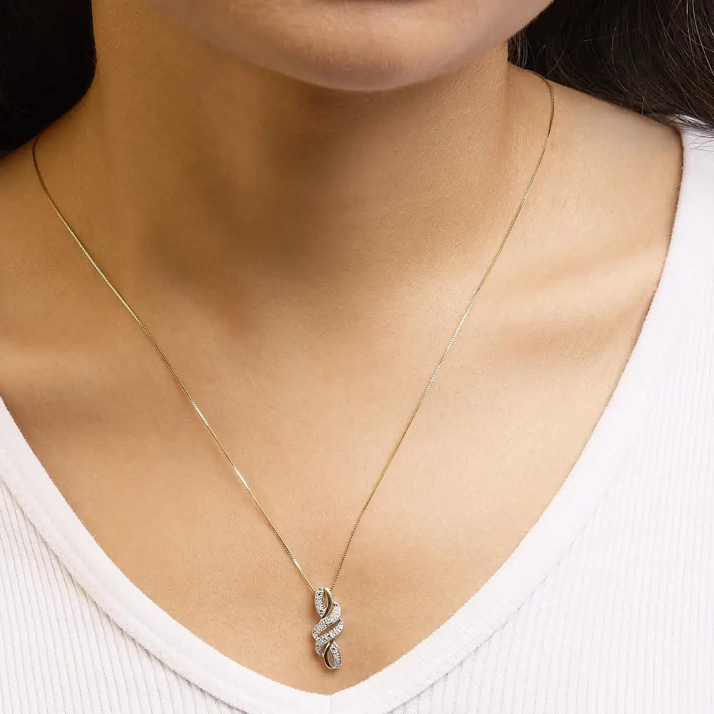 1/20 cttw diamond swirl pendant necklace in 10k yellow gold plated silver bijoux-nyc direct