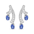 14k white gold oval tanzanite and 1/5 cttw diamond ribbon drop earrings bijoux-nyc direct