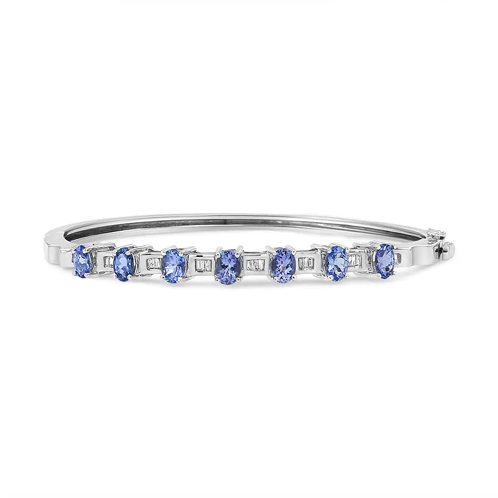 Oval tanzanite and 1/4 cttw diamond bangle bracelet in 14k white gold bijoux-nyc direct