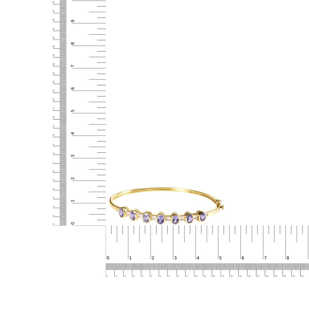 14k yellow gold alternating bezel set 5mm oval shaped tanzanite and 1/5 cttw diamond bangle bracelet (h i color vs2 si1 clarity)