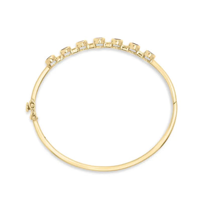 14k yellow gold alternating bezel set 5mm oval shaped tanzanite and 1/5 cttw diamond bangle bracelet (h i color vs2 si1 clarity)