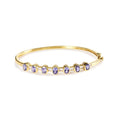 14k yellow gold oval tanzanite and diamond bezel bangle bracelet bijoux-nyc direct