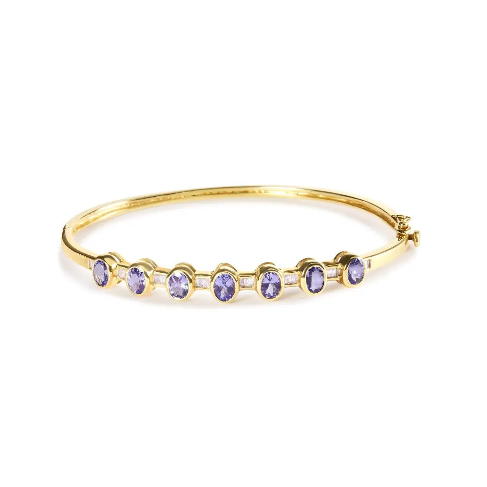 14k yellow gold alternating bezel set 5mm oval shaped tanzanite and 1/5 cttw diamond bangle bracelet (h i color vs2 si1 clarity)