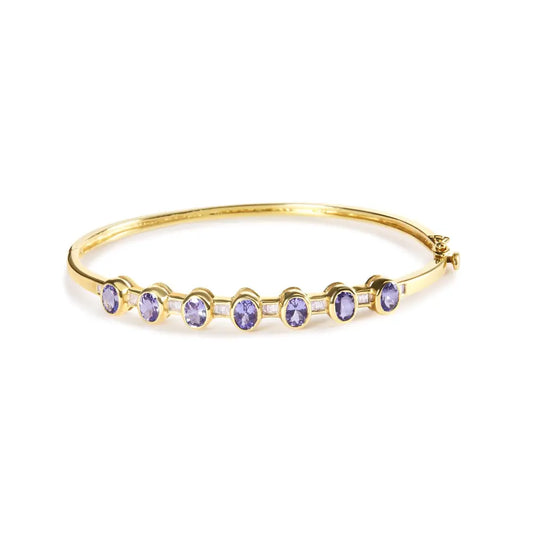 14k yellow gold alternating bezel set 5mm oval shaped tanzanite and 1/5 cttw diamond bangle bracelet (h i color vs2 si1 clarity)