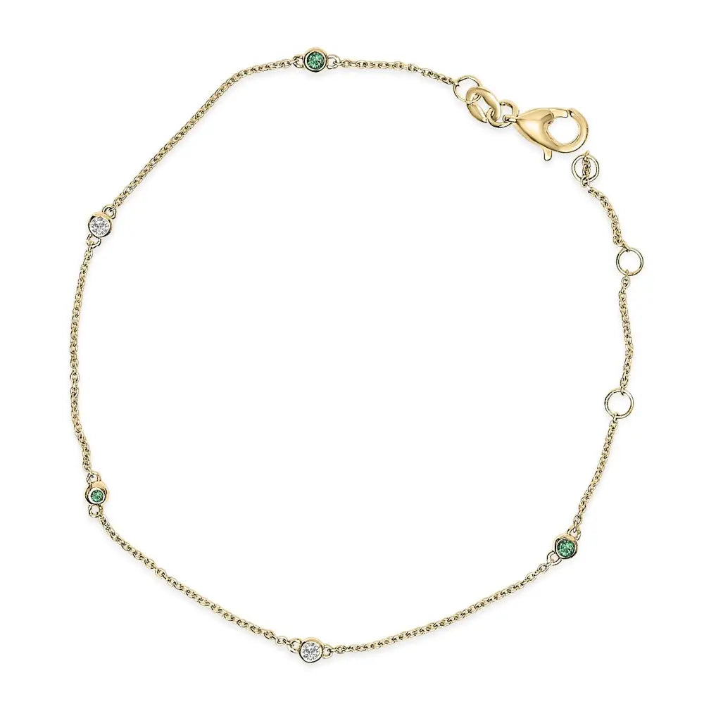 14k yellow gold alternating emerald and diamond bezel station bracelet bijoux-nyc direct
