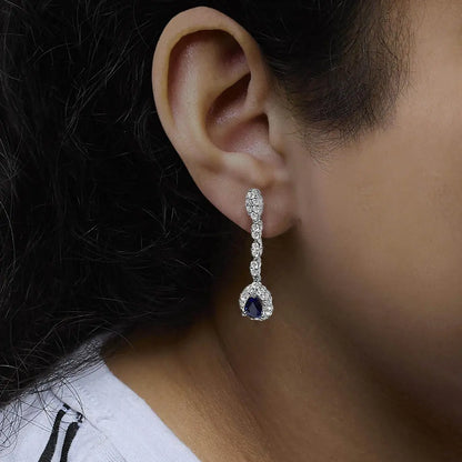 18K White Gold 1 3/5 Cttw Diamond and 7X5 MM Pear Shaped Blue Sapphire 1 1/3 Inch Drop and Dangle Halo Earrings (G-H Color, VS1-VS2 Clarity) - Bijoux-NYC Direct