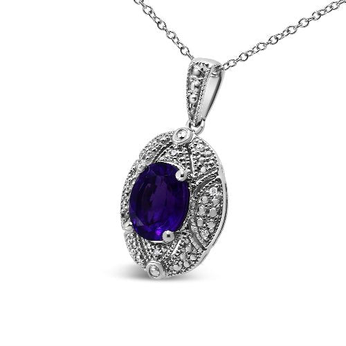 Silver pendant with a purple gemstone on a white background