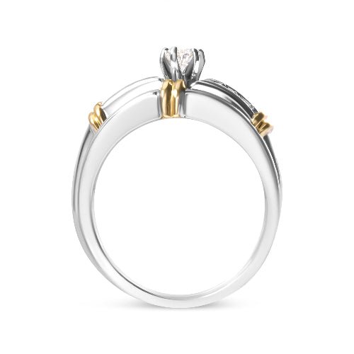 Two-tone ring with gold and silver design on a white background
