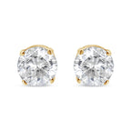 Pair of diamond stud earrings on a white background