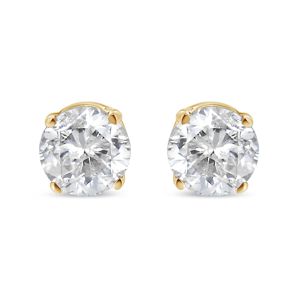 Pair of diamond stud earrings on a white background
