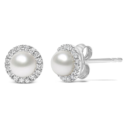 Pearl stud earrings with diamond accents on a white background