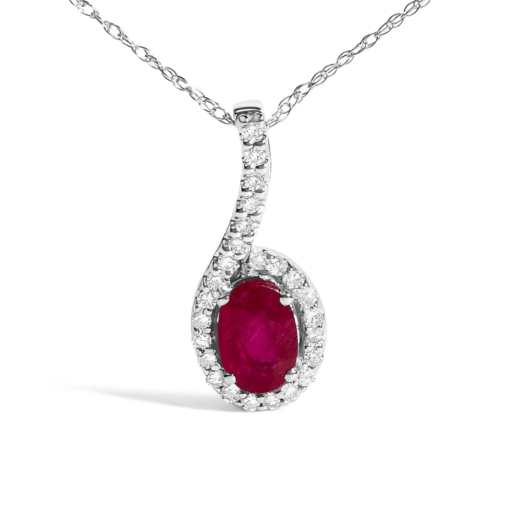 Diamond necklace with a central red gemstone on a white background