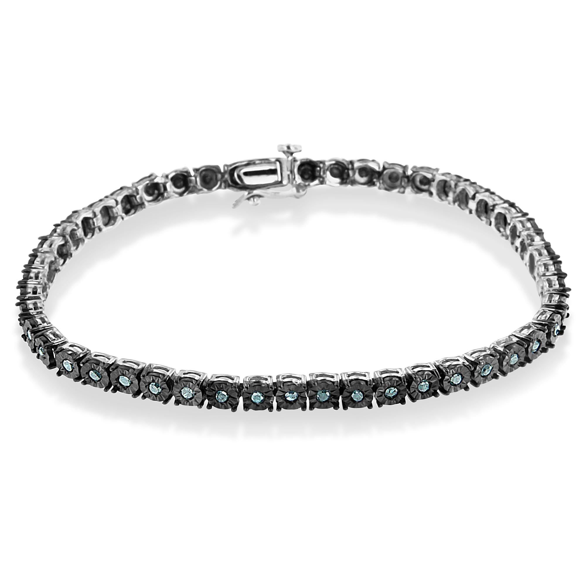 Silver bracelet with black stones on a white background