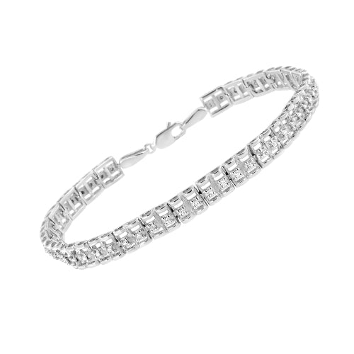 Silver bracelet with clear stones on a white background