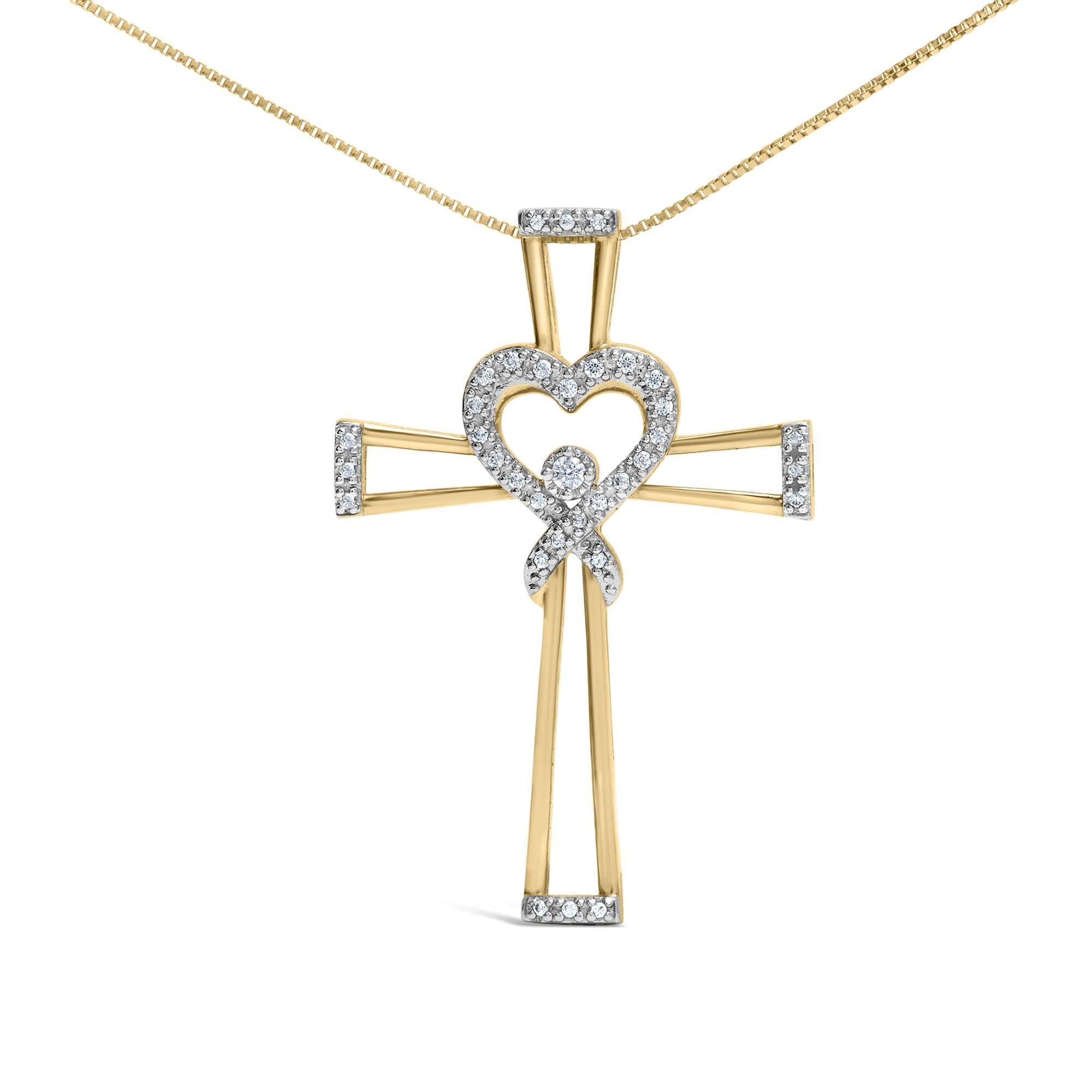 Gold cross pendant with heart design on a white background