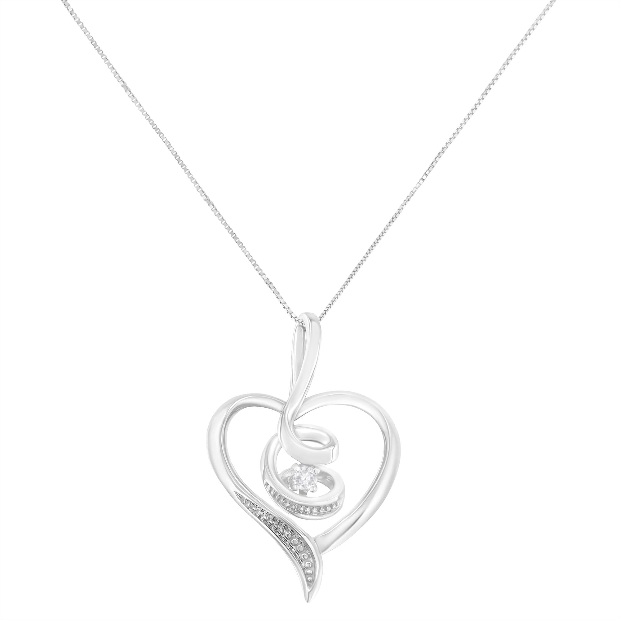 Silver heart-shaped pendant necklace on a white background