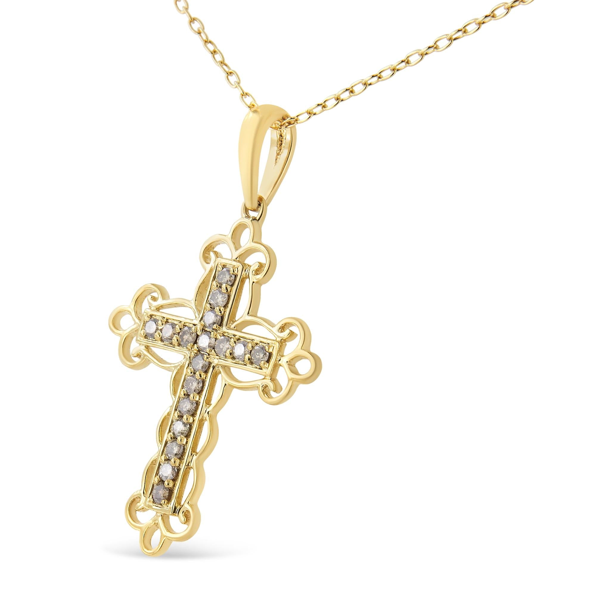 Gold cross pendant with diamonds on a white background