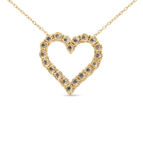 Gold heart-shaped necklace with embedded diamonds on a white background